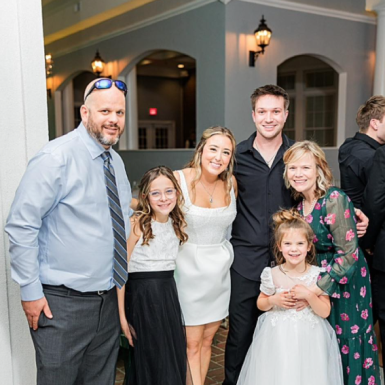 Kacey Carnegie and her family smiling for the camera