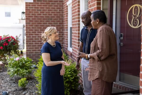 Kacey Carnegie knocking doors, talking with voters